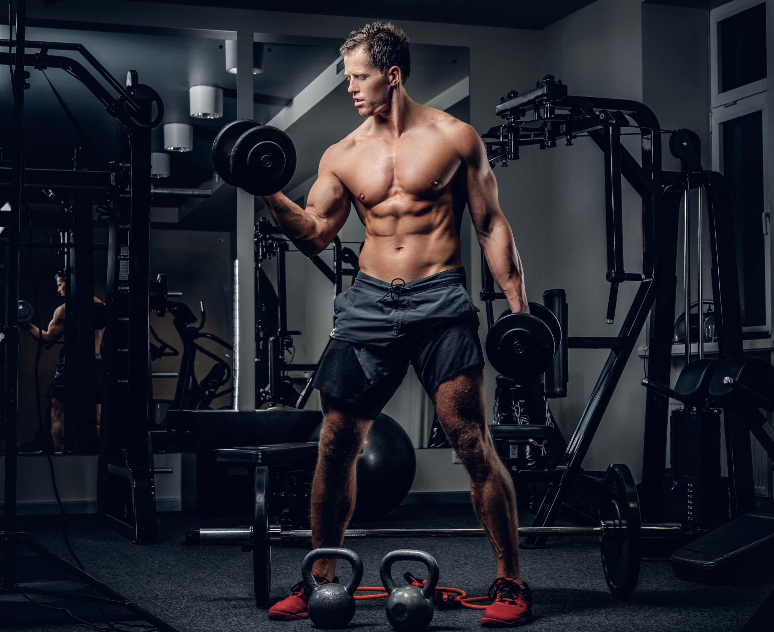 fullbodyportraitathleticshirtlessmaledoingbicepsworkoutswithdumbbellsgymclub21_9z04o_2584